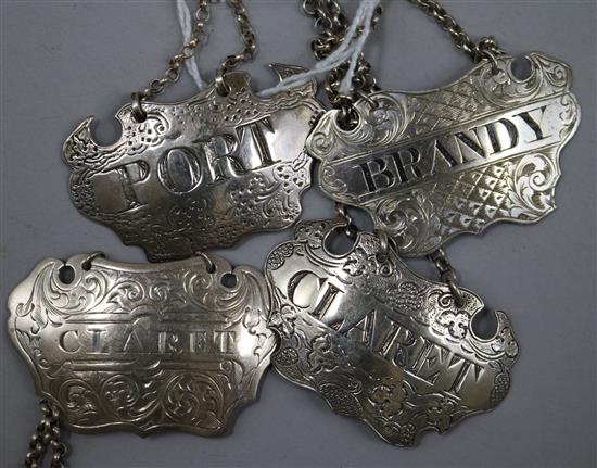 Four William IV/Victorian silver wine labels